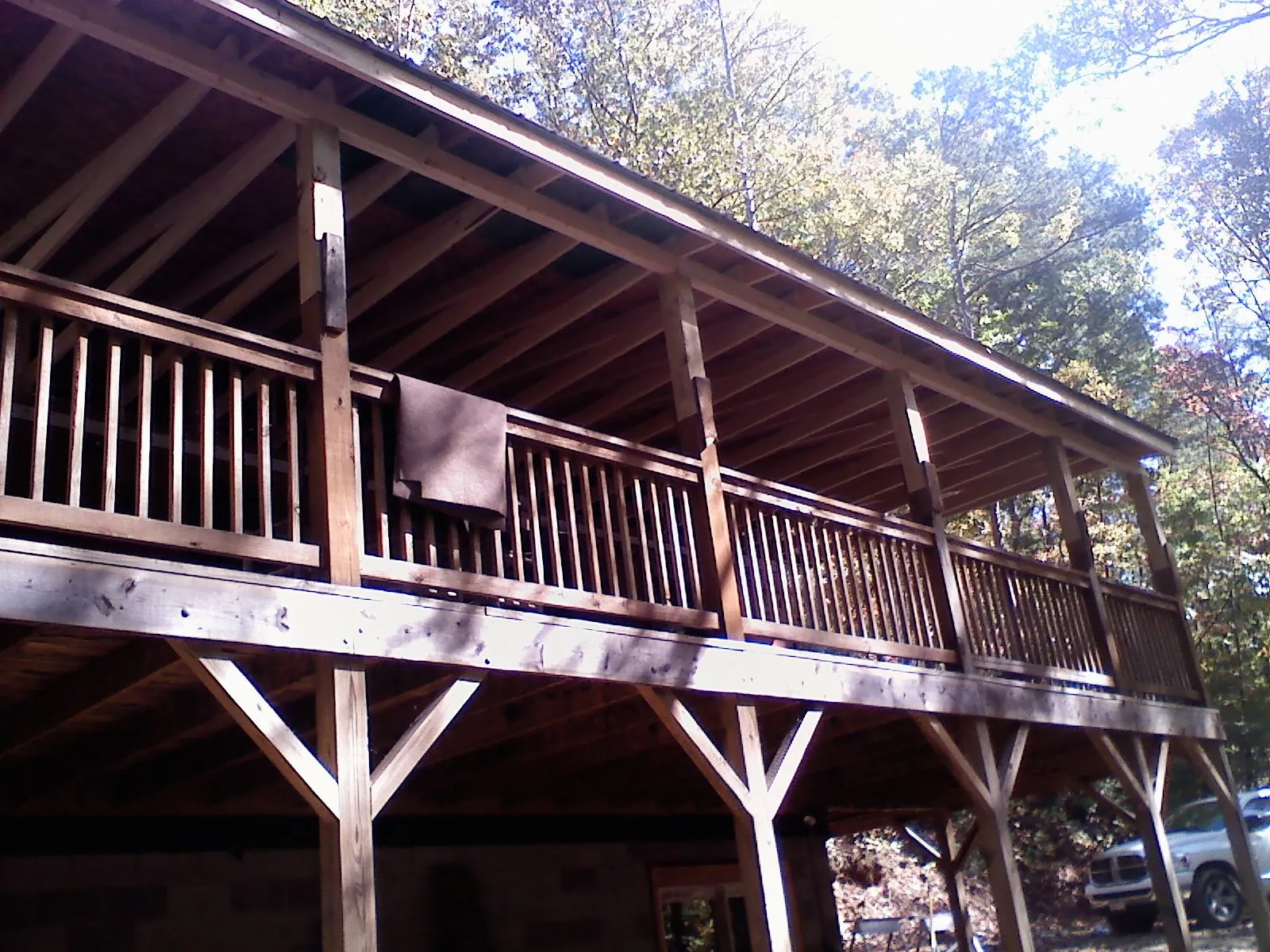 Timber framing under a new elevated porch and deck — Roof Leak Repair in Oakridge by Roofing Brothers